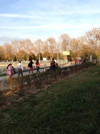 People on grassy field