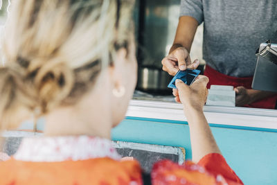 Rear view of people holding hands