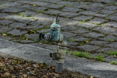 High angle view of fire hydrant on footpath