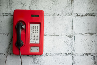 Close-up of telephone on wall