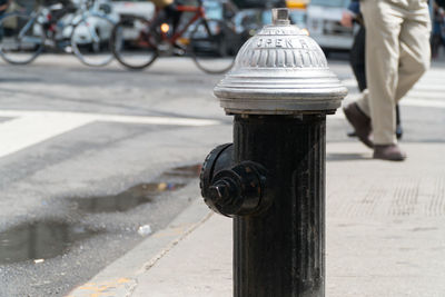 Close-up of bicycle on footpath