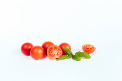 Close-up of tomatoes against white background