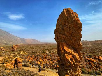 Rock formations on landscape against sky