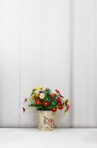 Decorative flower in ceramic planter.