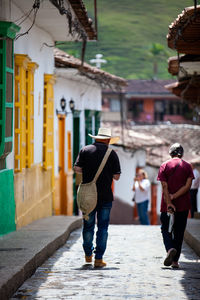 Local people wearing a traditional hat walking at the streets of concepcion in antioquia, colombia.