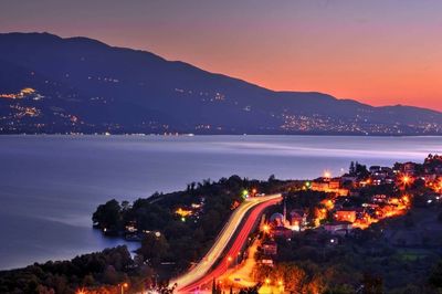 High angle view of light trails on road at night