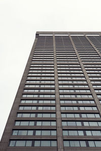 Low angle view of office building against sky