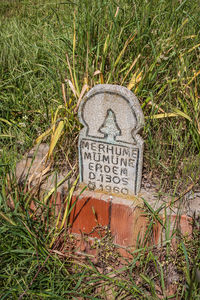 High angle view of text on grass