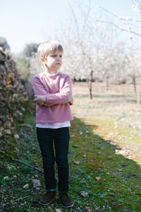 Full length of boy standing on field