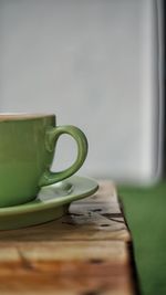 Close-up of coffee cup on table