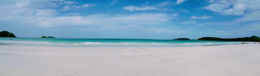 View of beach against cloudy sky