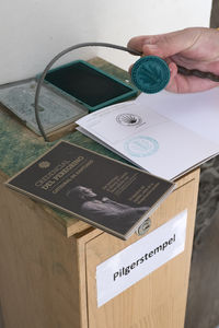 Close-up of hand holding navigational compass