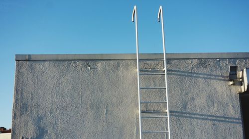 Low angle view of building against blue sky