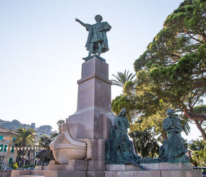 Low angle view of statue against sky