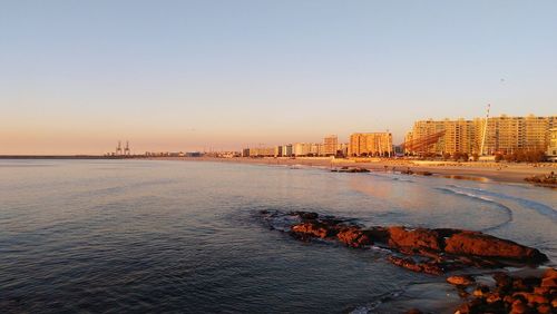 Scenic view of sea against clear sky during sunset