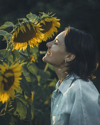 Side view of young woman looking away