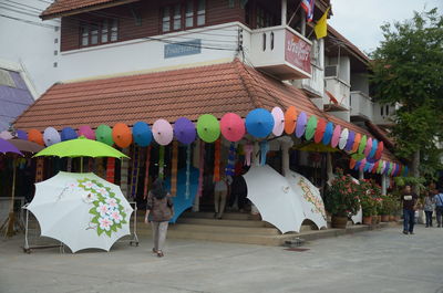 People in traditional building in city