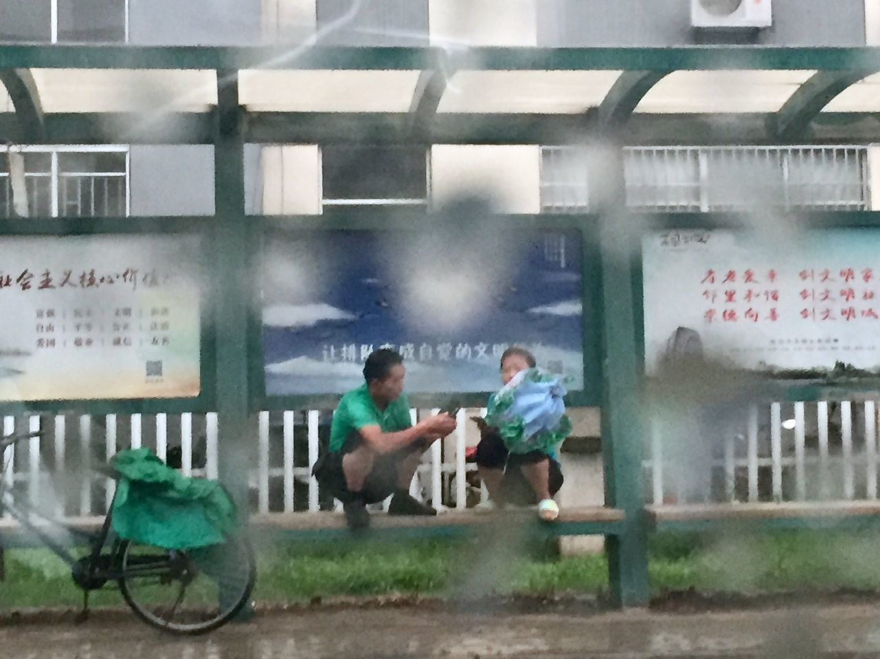 SIDE VIEW OF PEOPLE ON GLASS WINDOW OF BUS