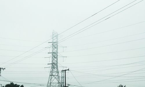 Low angle view of electricity pylon