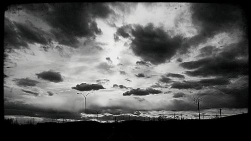 Scenic view of landscape against cloudy sky