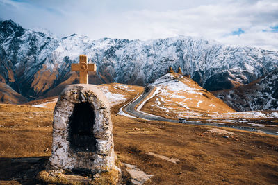 Scenic view of snowcapped mountains against sky