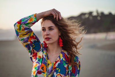 Portrait of young woman looking away