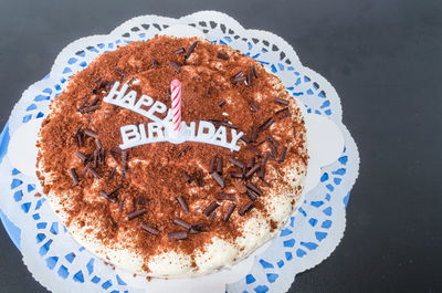 Close-up of birthday cake with candles