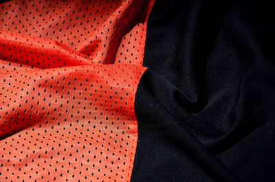 Close-up of crumpled red and black textile