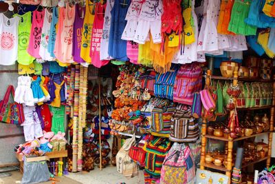 Multi colored flags hanging at market stall