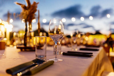 Luxury table settings for fine dining with and glassware, beautiful blurred background. 