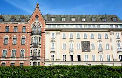 Low angle view of building against blue sky