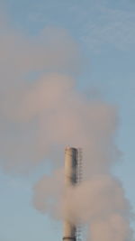 Low angle view of metal against sky