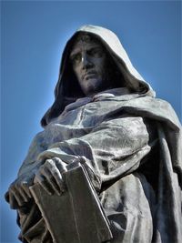 Low angle view of statue against clear blue sky