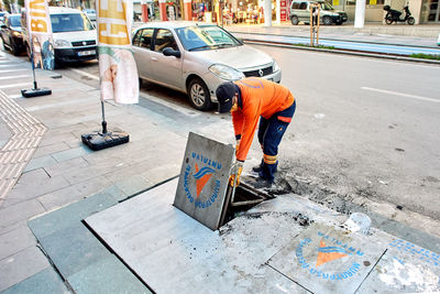 Man working on city street