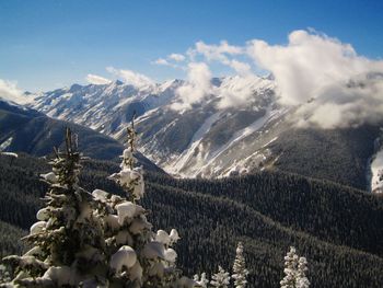 Scenic view of snow covered mountains against sky