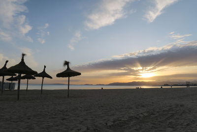 Scenic view of beach against sky during sunset