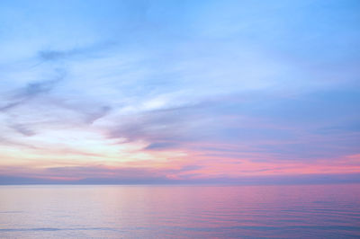 Scenic view of sea against sky at sunset