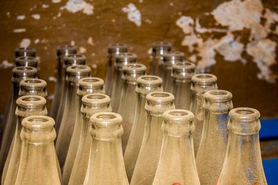 Close-up of bottles against wall