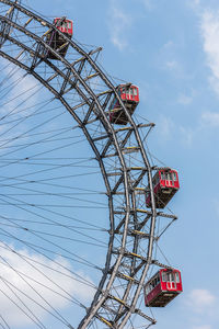 Low angle view of ferris wheel against sky