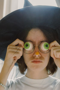 Portrait of young woman wearing hat