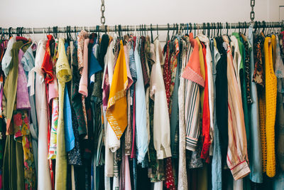 View of clothes hanging at market stall