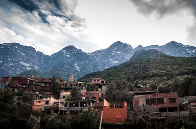 Scenic view of residential district against sky