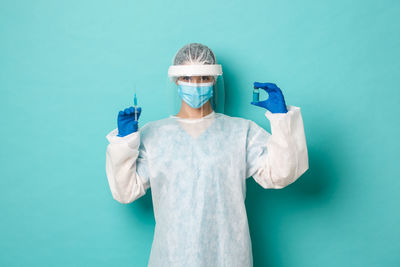 View of a man holding blue background