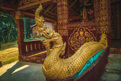 Sculpture of statues outside building