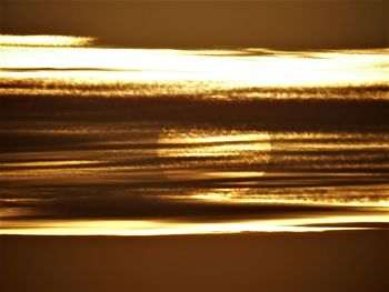 Scenic view of beach against sky during sunset