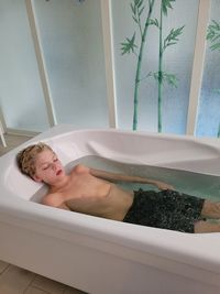 A boy in a bathtub