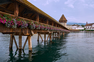 Scenic view of house by building against sky