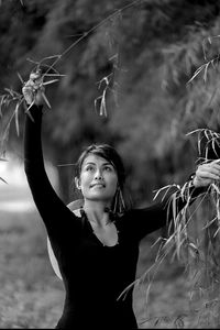 Portrait of young woman standing outdoors