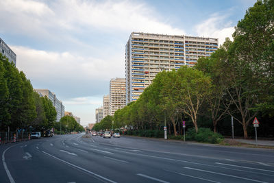 Cars on road against sky