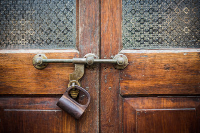Close-up of padlock on door